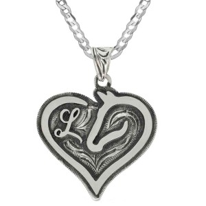 A custom heart pendant necklace built on a silver base, with a sterling silver chain